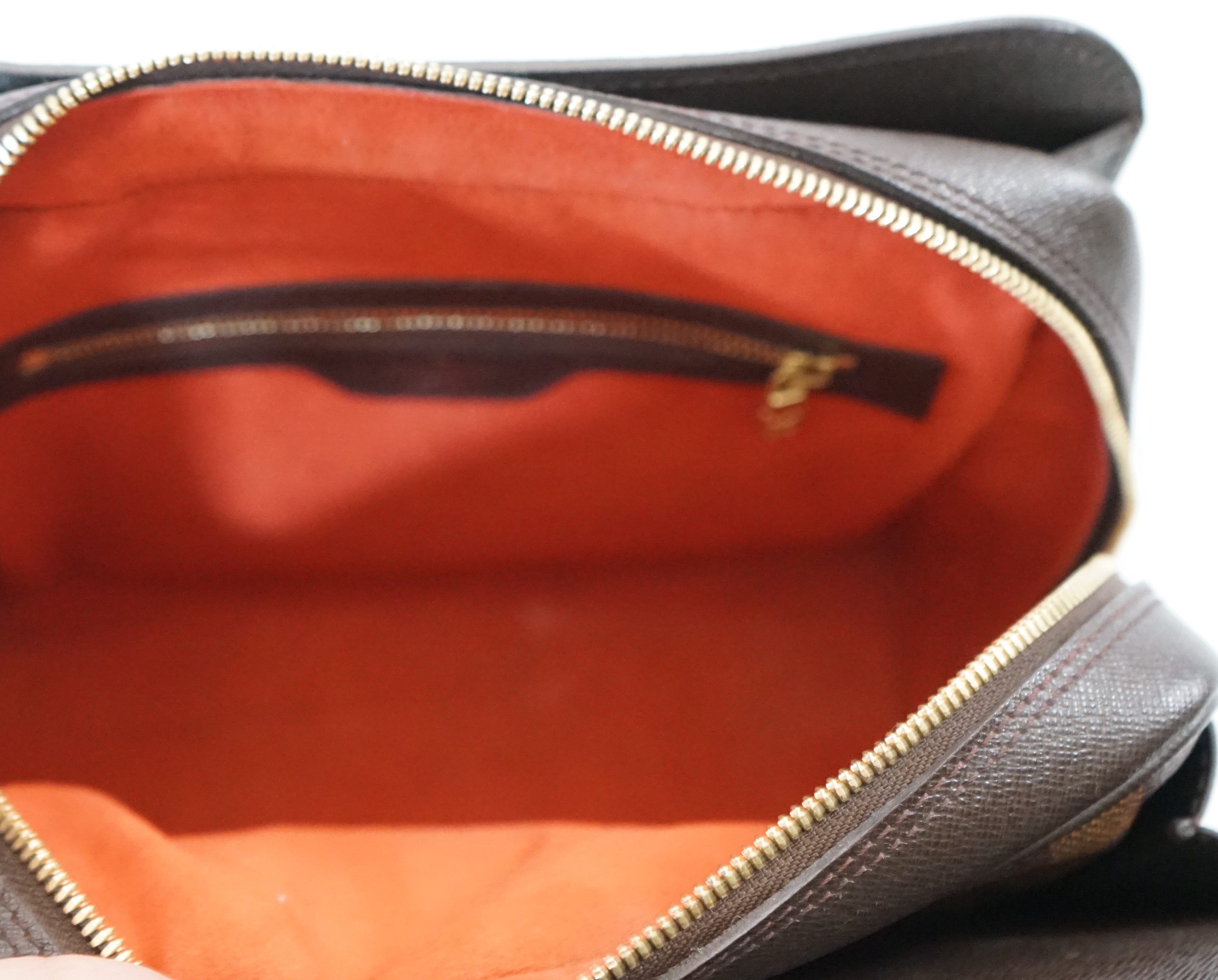 A Louis Vuitton Triana handbag, styled in Damier canvas width 26cm, depth 12cm, height 22cm handle 11cm